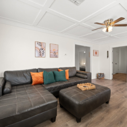 Living room with a large leather sectional and ottoman