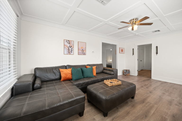 Living room with a large leather sectional and ottoman