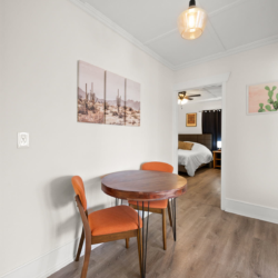 Dining nook for four with a view into the bedroom