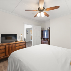 Bedroom with a dresser and TV