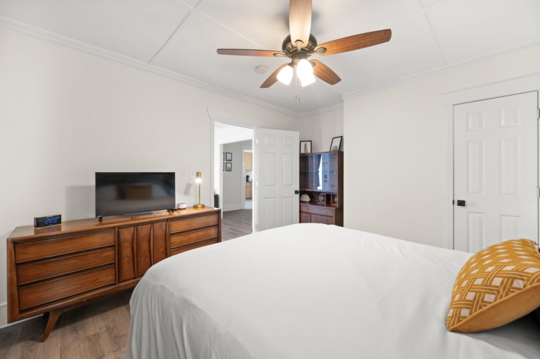 Bedroom with a dresser and TV
