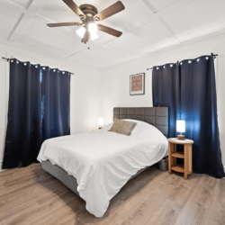 Second bedroom with dark curtains