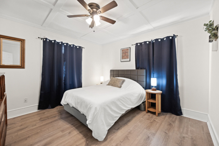 Second bedroom with dark curtains