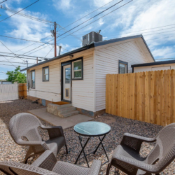 Private fenced backyard with patio seating