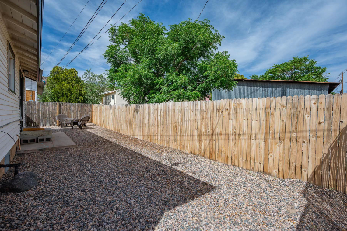 Fenced yard on the side of the house