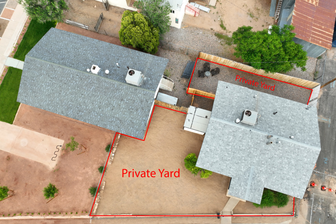 Aerial view of the home and its private fenced yard