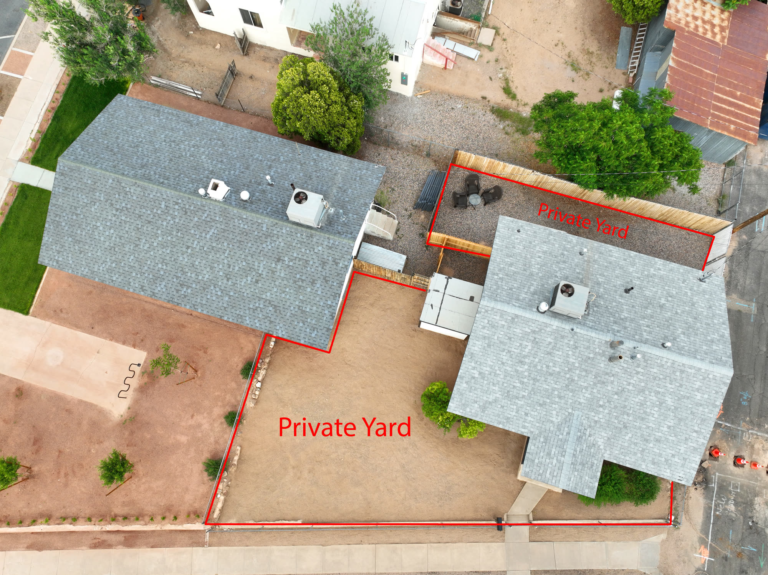 Aerial view of the home and its private fenced yard